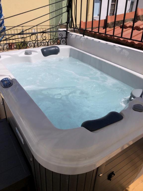 a jacuzzi tub in a balcony at Evagelia's Villas in Skopelos Town