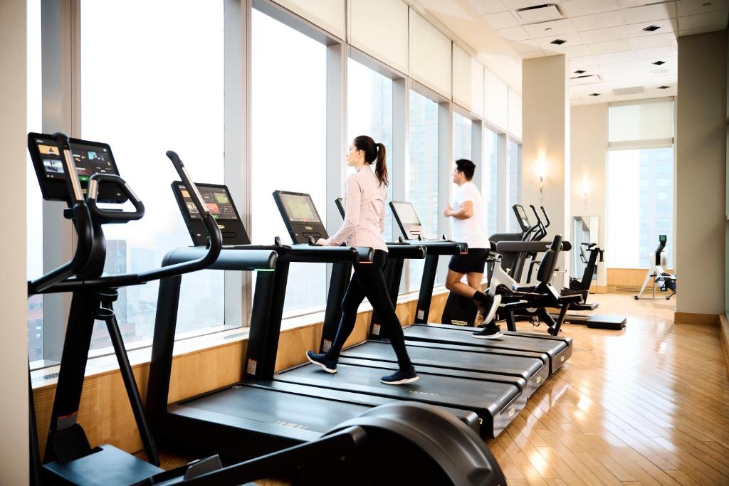 two women walking on a treadmill in a gym at Mandarin Oriental, New York in New York