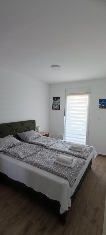 Postel nebo postele na pokoji v ubytování Apartman Fiora