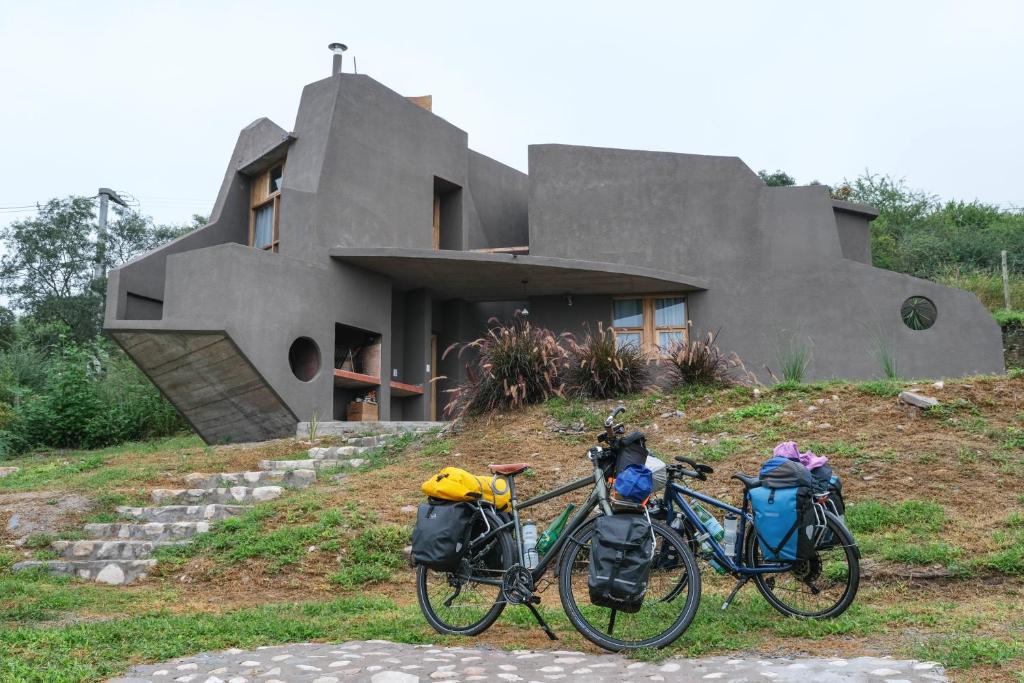two bikes parked in front of a house at Cueva Ancestral --Experiencia entre los cerros-- in Coronel Moldes