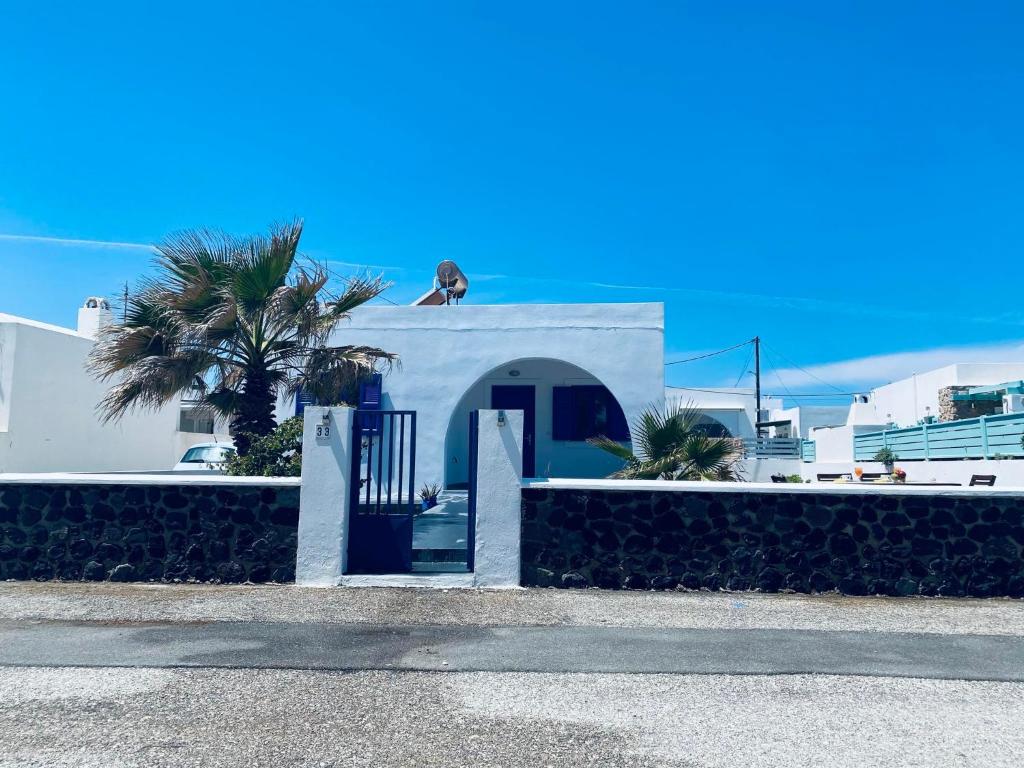 a dog sitting on top of a building at Villa 33 in Monolithos