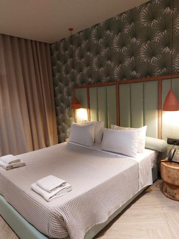 Postel nebo postele na pokoji v ubytování Hotel Coral