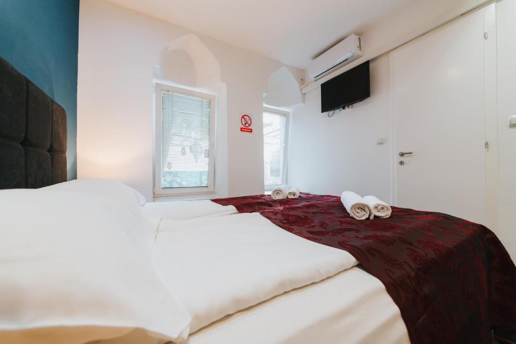 Postel nebo postele na pokoji v ubytování Hotel Old Town Residence
