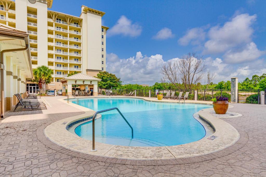 a swimming pool in the middle of a building at Perdido Key Condo with Views and Golf Club Access! in Pensacola
