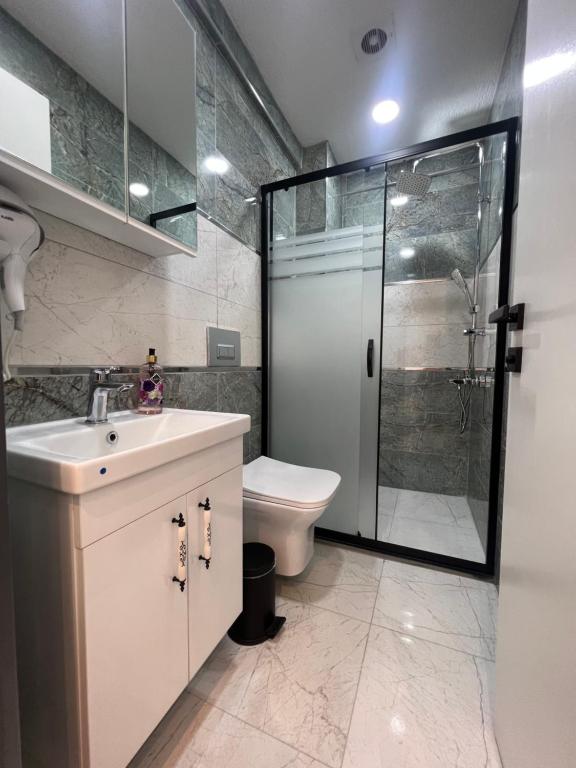 Koupelna v ubytování Feycem Suites Hotel