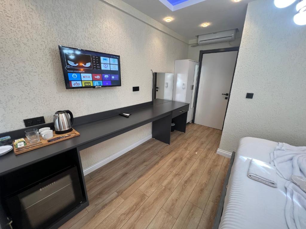 Postel nebo postele na pokoji v ubytování Feycem Suites Hotel