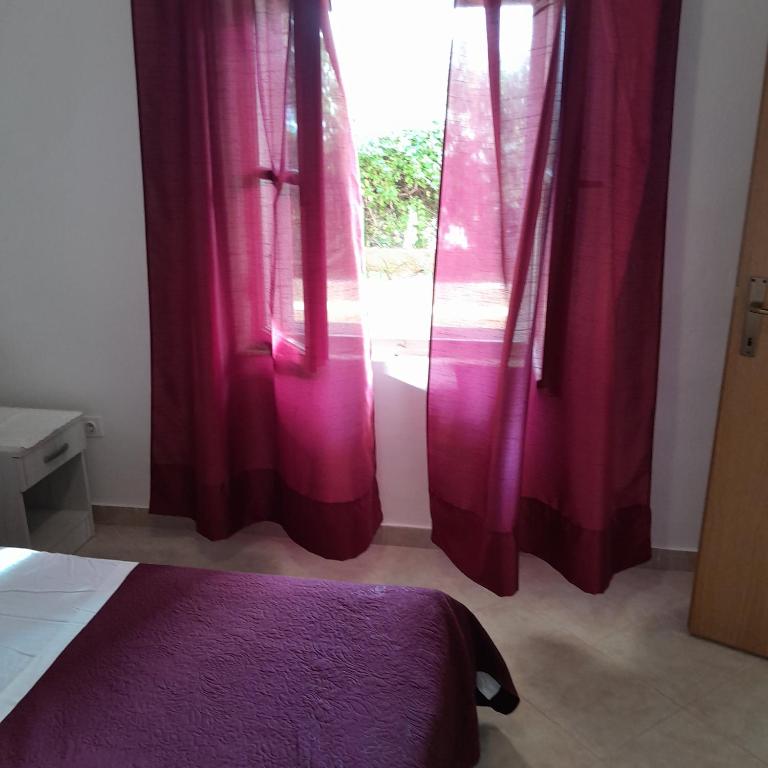 Postel nebo postele na pokoji v ubytování Apartments Viganj