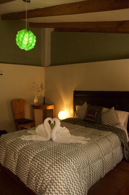 Postel nebo postele na pokoji v ubytování Hotel Inka King