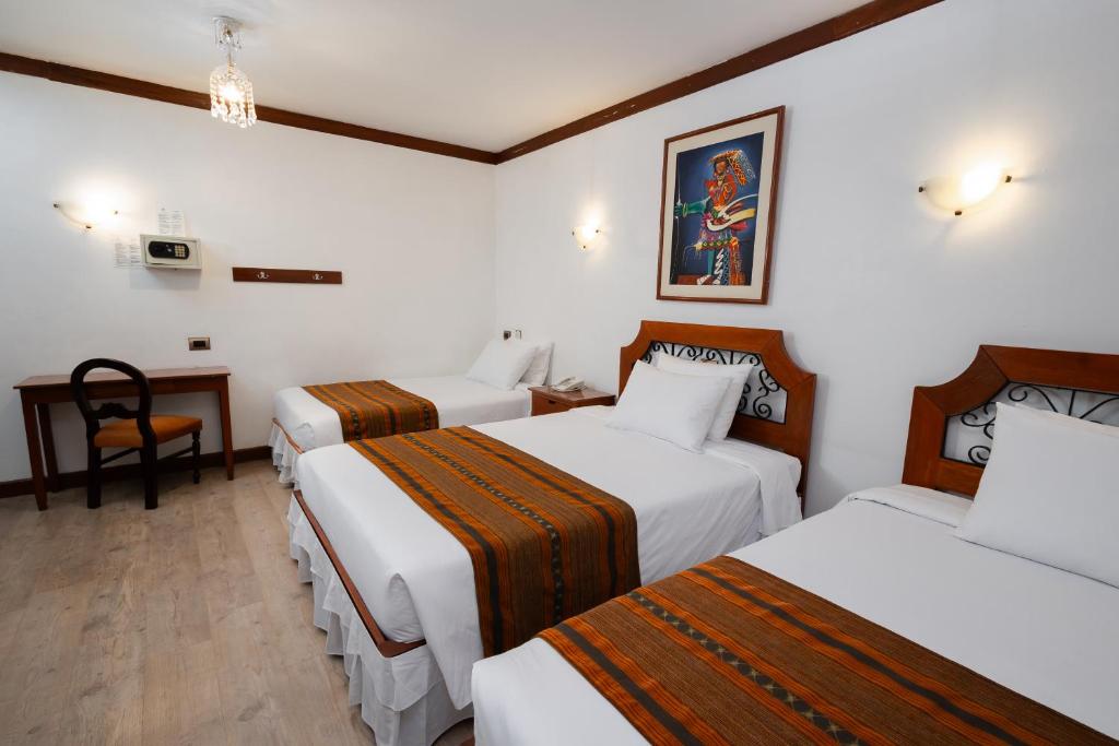Postel nebo postele na pokoji v ubytování Hotel Hacienda Cusco Plaza