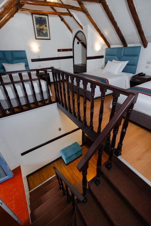 Postel nebo postele na pokoji v ubytování Hotel Hacienda Cusco Plaza