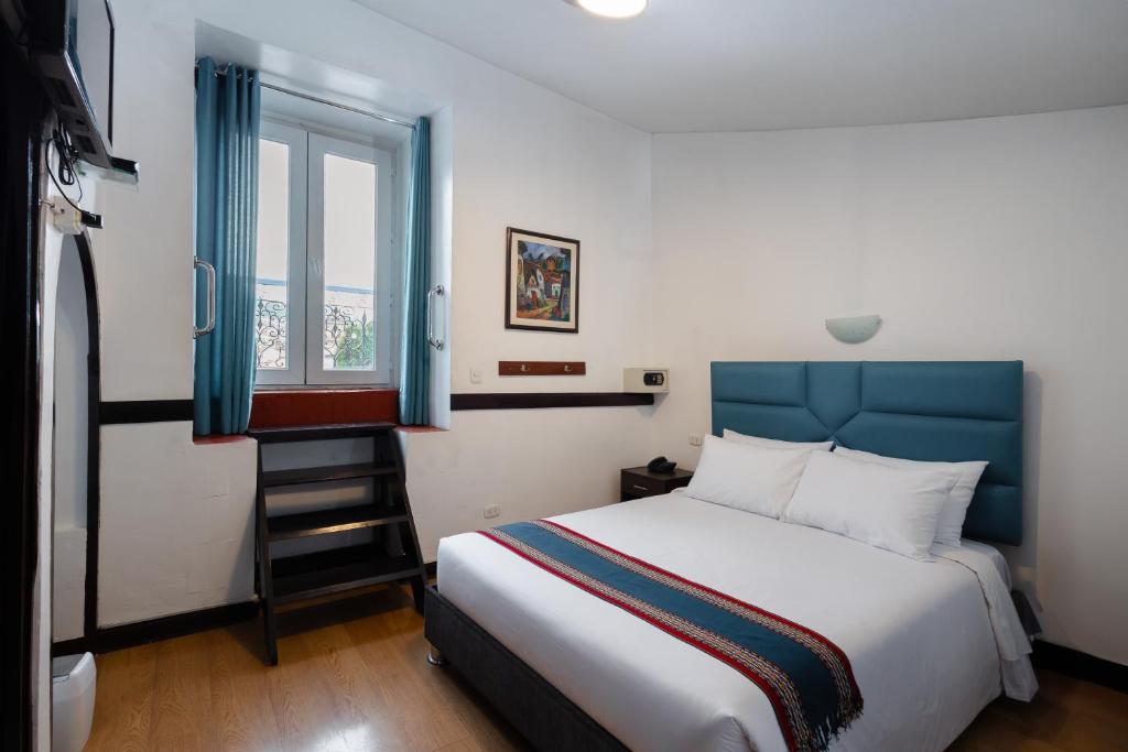 Postel nebo postele na pokoji v ubytování Hotel Hacienda Cusco Plaza