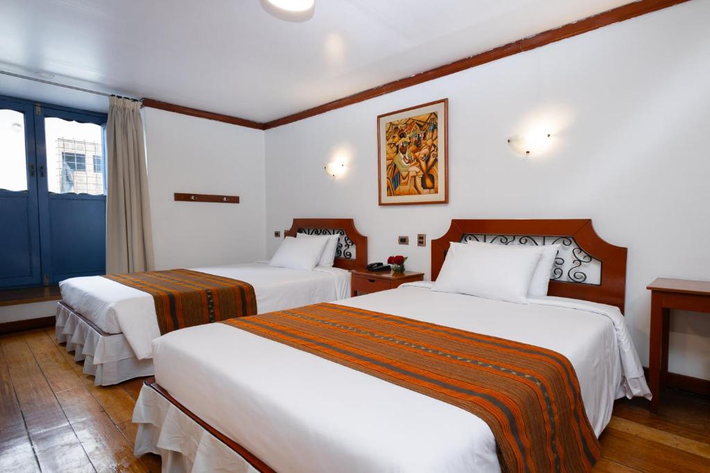 Postel nebo postele na pokoji v ubytování Hotel Hacienda Cusco Plaza