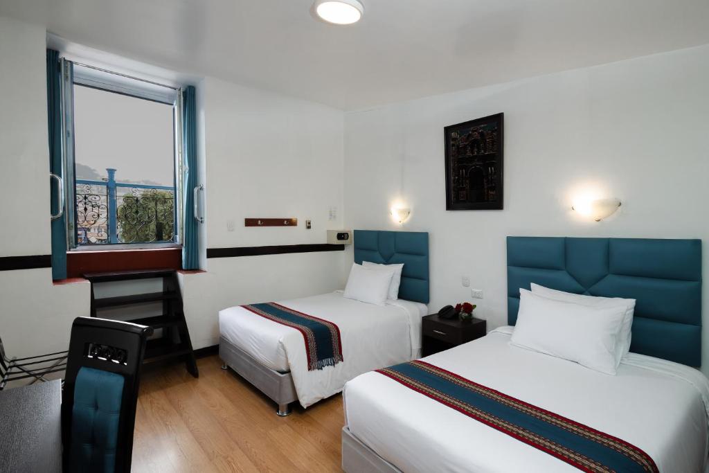 Postel nebo postele na pokoji v ubytování Hotel Hacienda Cusco Plaza