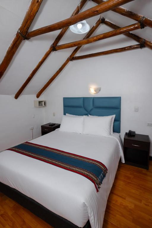Postel nebo postele na pokoji v ubytování Hotel Hacienda Cusco Plaza