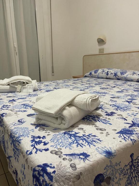 Postel nebo postele na pokoji v ubytování Hotel Vienna Rivazzurra