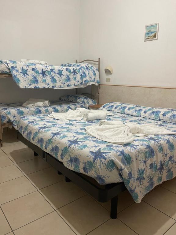 Postel nebo postele na pokoji v ubytování Hotel Vienna Rivazzurra