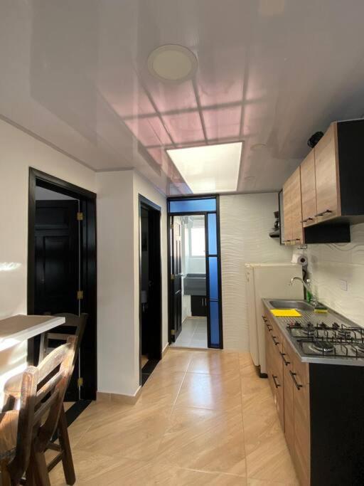 Kuchyň nebo kuchyňský kout v ubytování Apartaestudio Chiqui-house