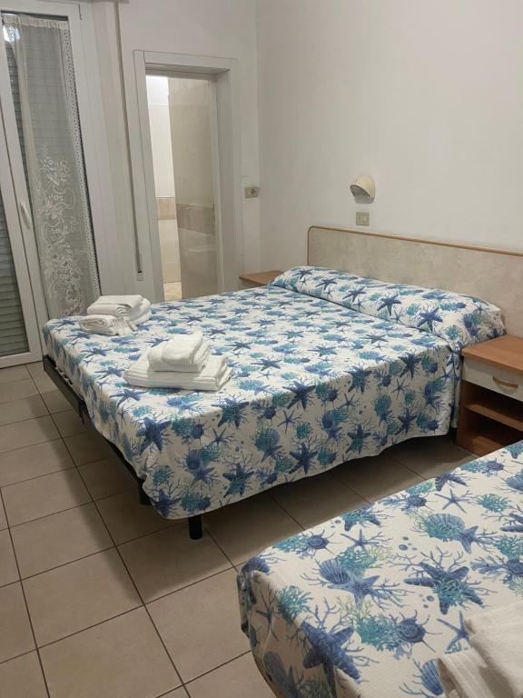 Postel nebo postele na pokoji v ubytování Hotel Vienna Rivazzurra