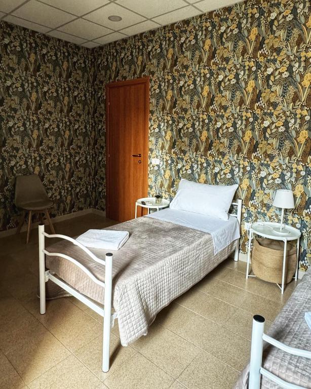 Postel nebo postele na pokoji v ubytování Sicily O'Clock Room