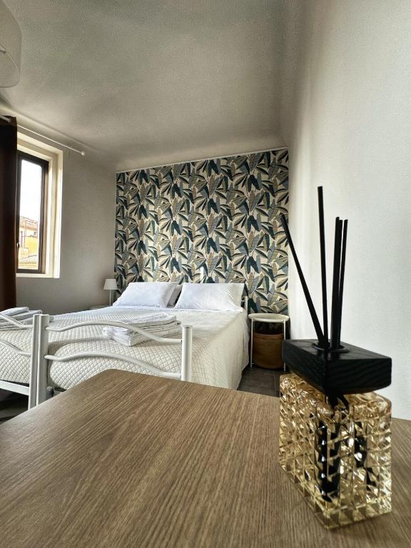 Postel nebo postele na pokoji v ubytování Sicily O'Clock Room