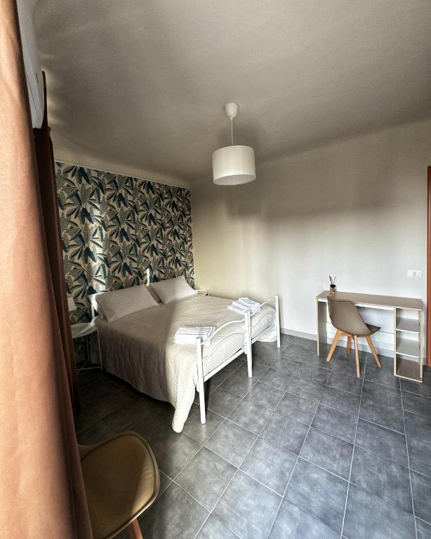 Postel nebo postele na pokoji v ubytování Sicily O'Clock Room