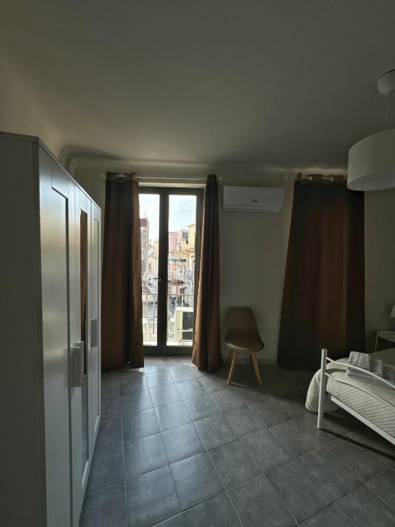 Postel nebo postele na pokoji v ubytování Sicily O'Clock Room