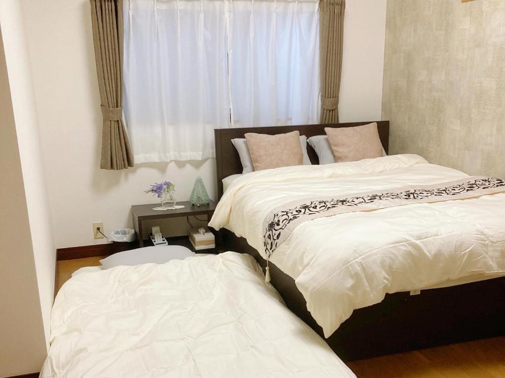 Postel nebo postele na pokoji v ubytování Guesthouse cherry