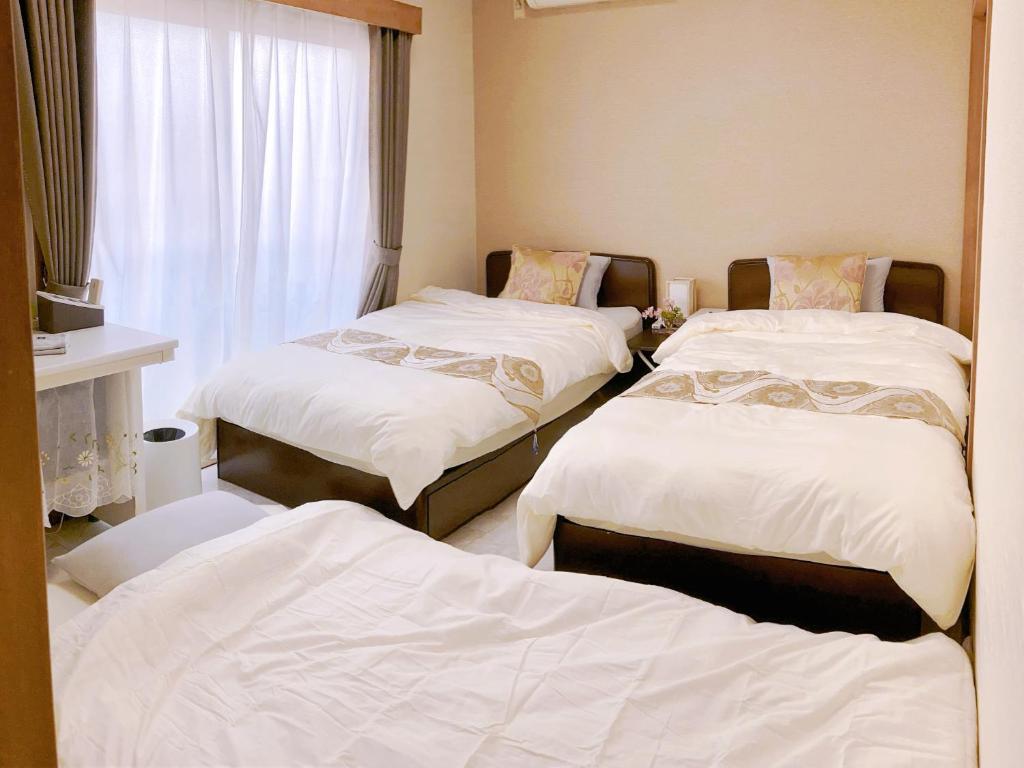 Postel nebo postele na pokoji v ubytování Guesthouse cherry
