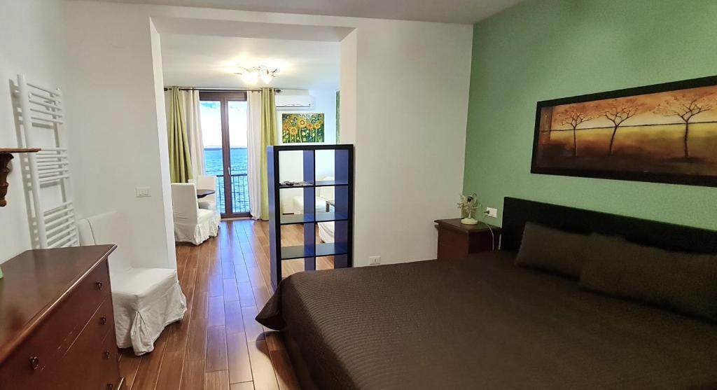 Postel nebo postele na pokoji v ubytování L'ISOLA AeR B&B