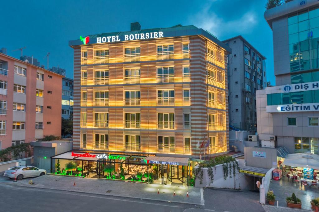 a hotel building with a sign on top of it at Hotel Boursier 1 & Spa in Istanbul