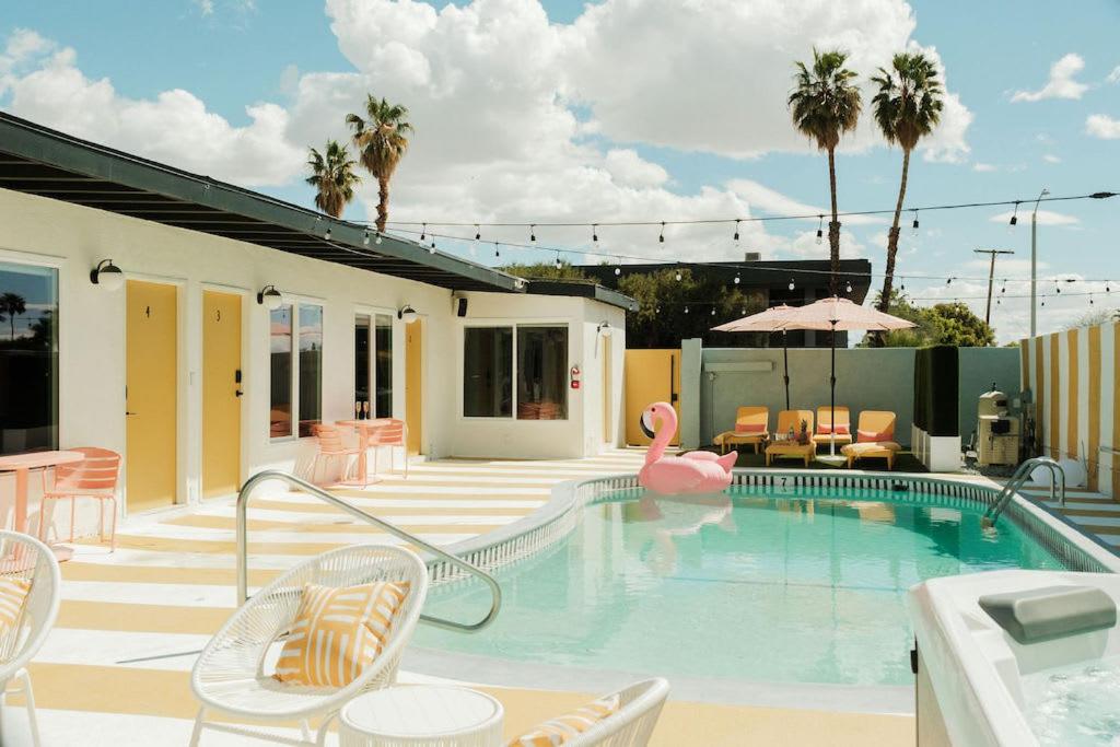 a swimming pool with a pink flamingo in the middle at Mod Hotel in Palm Springs