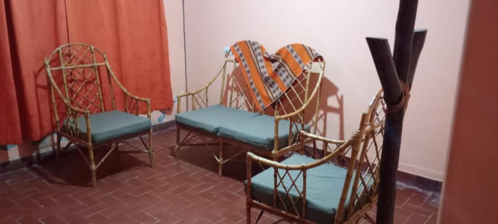 a group of chairs sitting in a room at Casa Aires del hornocal in Humahuaca