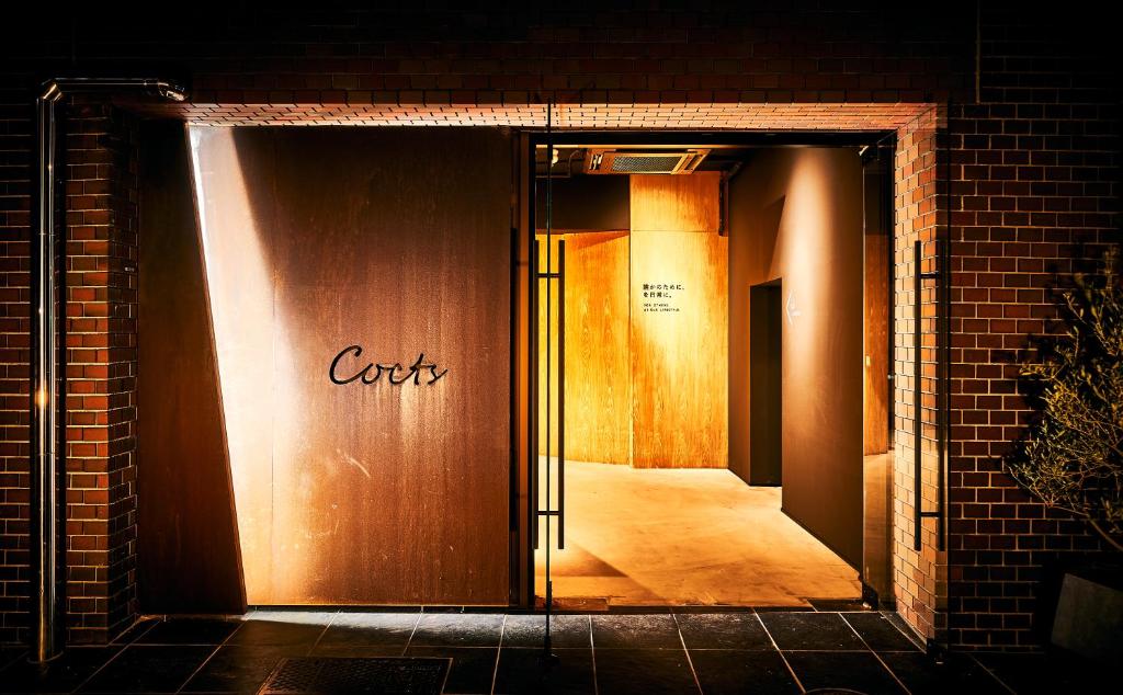 an open door with the words cork written on it at Cocts Akihabara in Tokyo