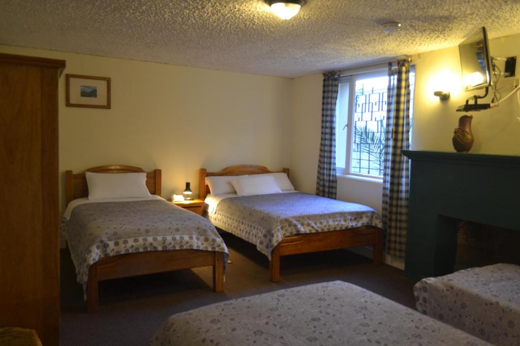 Postel nebo postele na pokoji v ubytování Travellers Inn