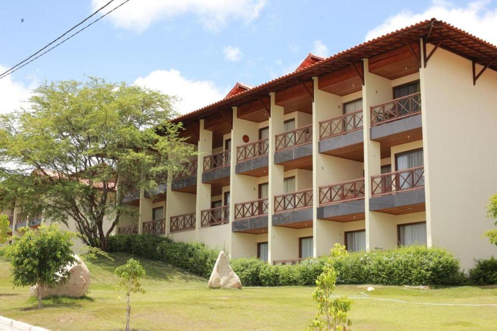 a building with balconies on the side of it at Monte Castelo in Bezerros