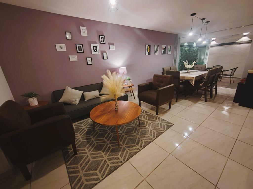 a living room with a couch and a table at Casa Real San Marcos B en Privada Zona Norte in Irapuato