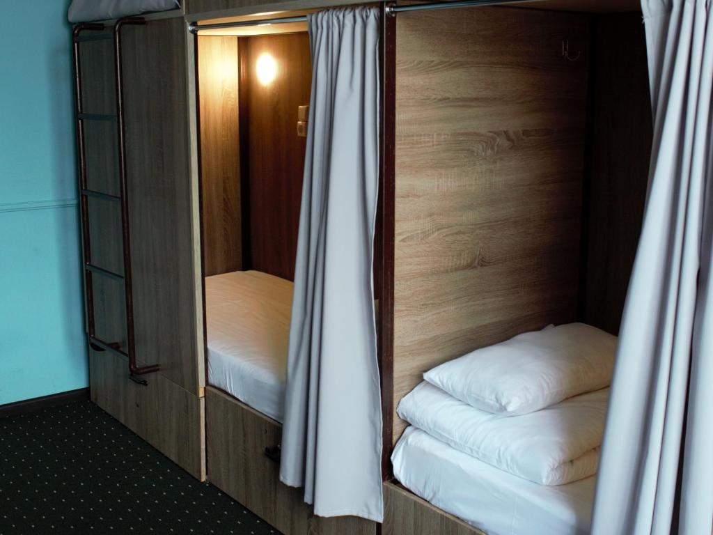 Letto o letti in una camera di All Eyes Hostel