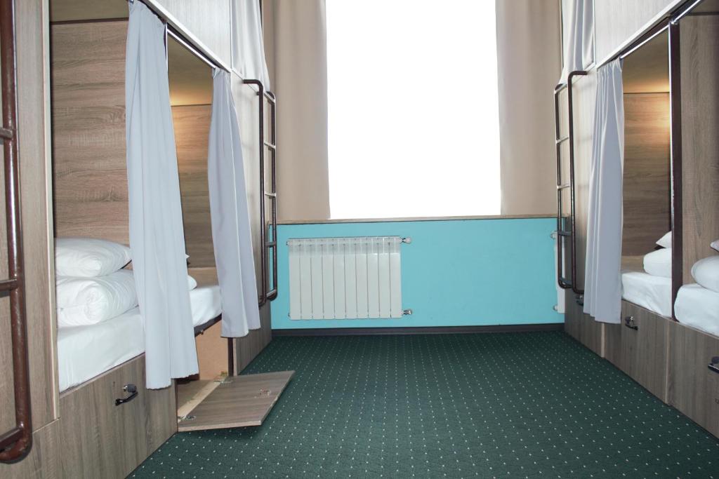 Letto o letti in una camera di All Eyes Hostel