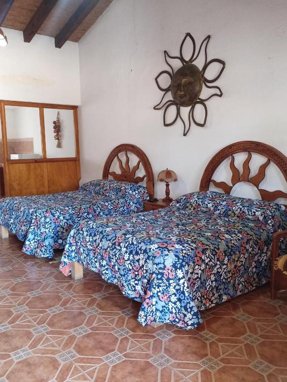 Postel nebo postele na pokoji v ubytování Hotel Cabañas Chalamu
