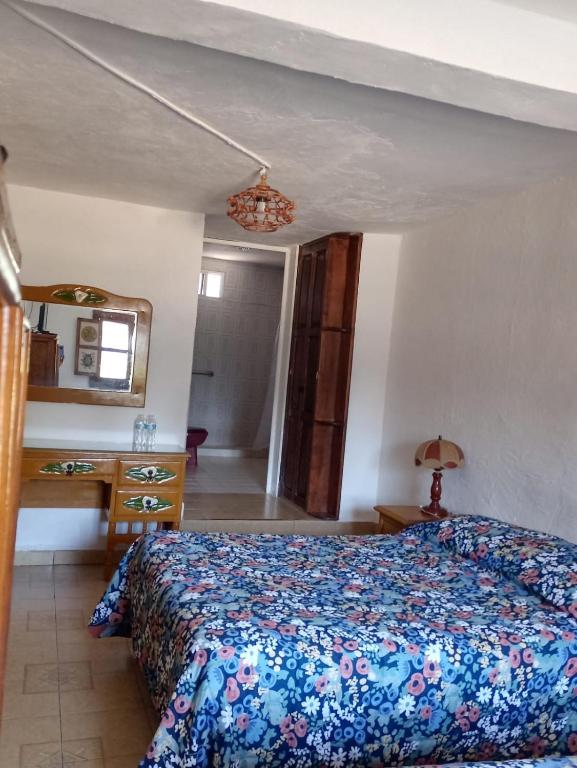 Postel nebo postele na pokoji v ubytování Hotel Cabañas Chalamu