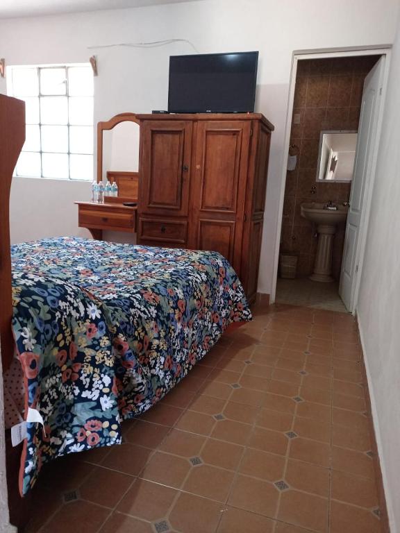 Postel nebo postele na pokoji v ubytování Hotel Cabañas Chalamu