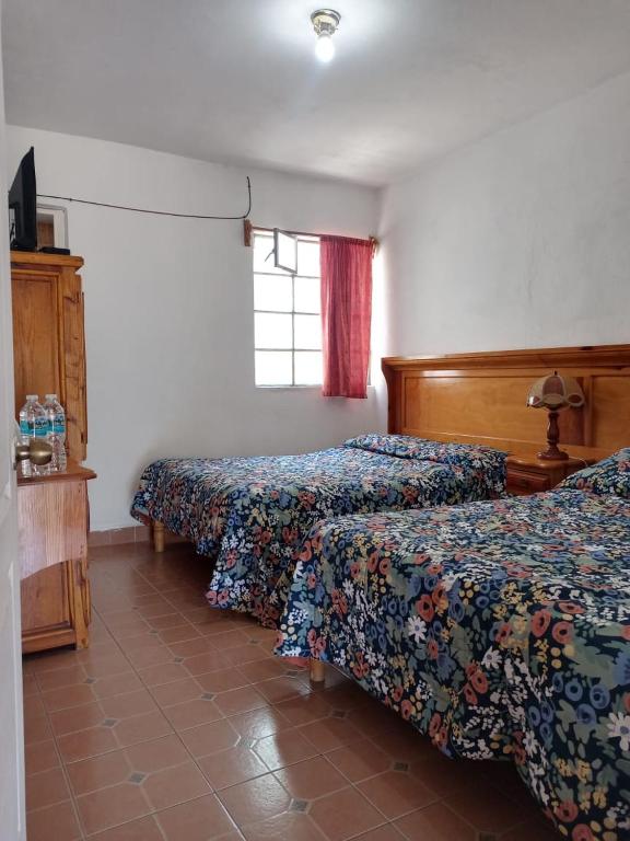 Postel nebo postele na pokoji v ubytování Hotel Cabañas Chalamu