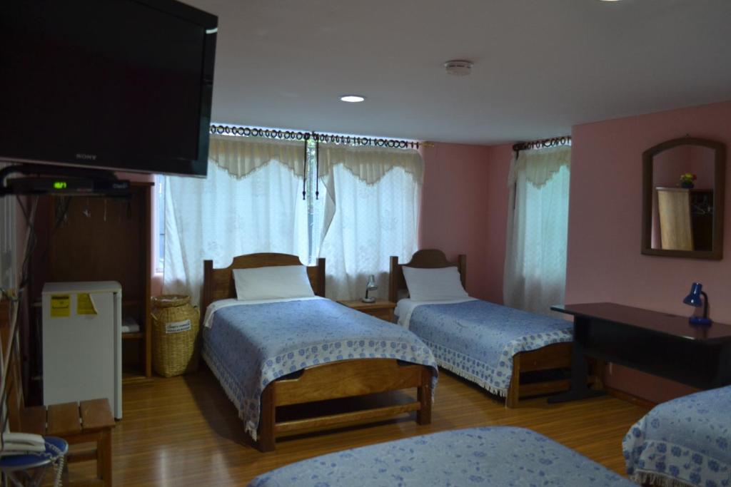 Postel nebo postele na pokoji v ubytování Travellers Inn