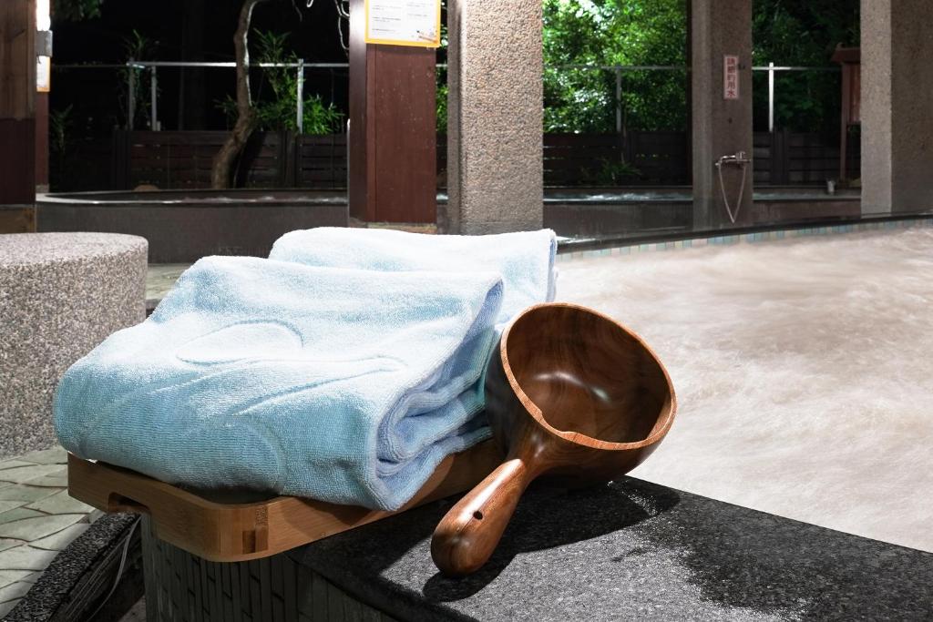 Postel nebo postele na pokoji v ubytování Hoya Hot Springs Resort, Guanziling