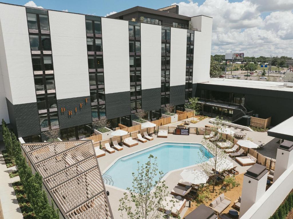 an aerial view of a hotel with a pool and chairs at Drift Nashville, a Member of Design Hotels in Nashville