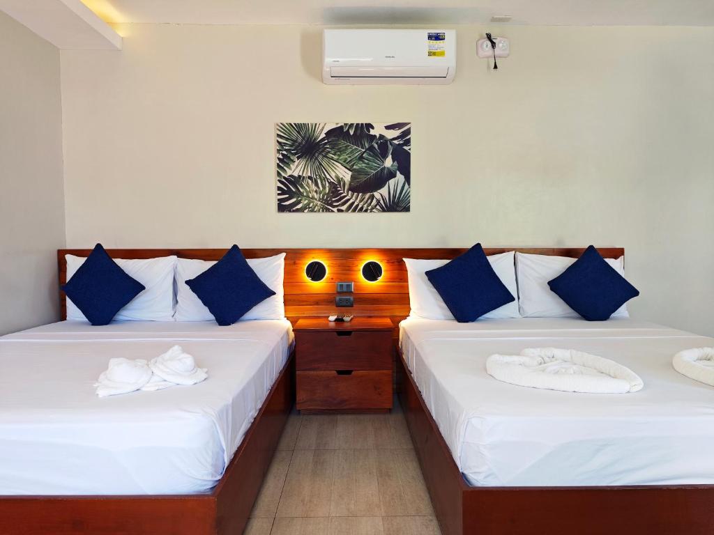 Postel nebo postele na pokoji v ubytování OHANA, Panglao Resort.