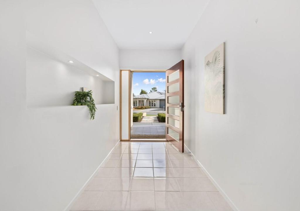 a hallway with a door leading to a house at Premium Barossa Getaway in Tanunda