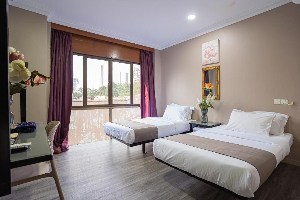 Postel nebo postele na pokoji v ubytování HOTEL 28 RAPID