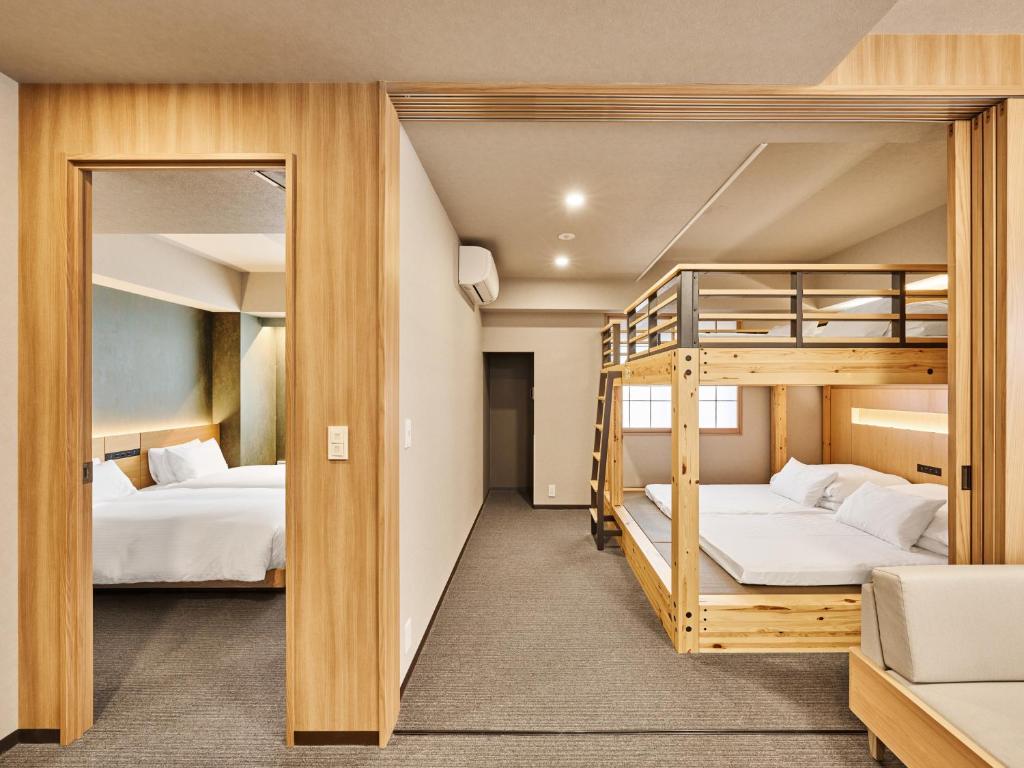 Postel nebo postele na pokoji v ubytování MIMARU SUITES Tokyo Nihombashi