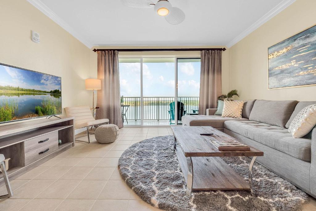a living room with a couch and a table at K and J Orlando in Orlando
